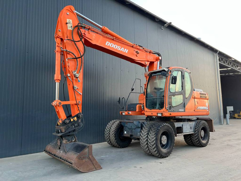 Doosan DX170W - 轮式挖掘机:图1 Doosan DX170W - 轮式挖掘机:图1