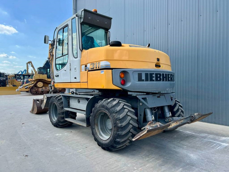 Liebherr A311 Litronic - 轮式挖掘机:图2 Liebherr A311 Litronic - 轮式挖掘机:图2