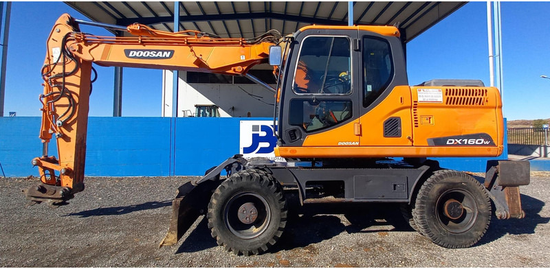 Doosan DX140W-3 - 轮式挖掘机:图1 Doosan DX140W-3 - 轮式挖掘机:图1