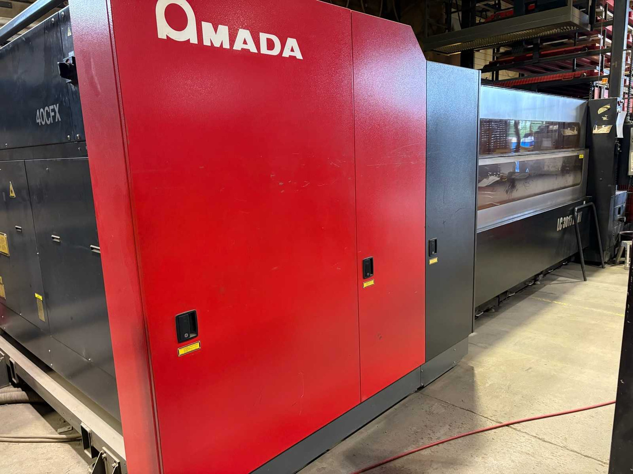 CNC Controlled CO2 Laser Cutting Machine Amada LC 3015 X1 NT - 金属加工机械:图2 CNC Controlled CO2 Laser Cutting Machine Amada LC 3015 X1 NT - 金属加工机械:图2