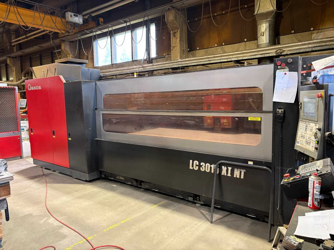 CNC Controlled CO2 Laser Cutting Machine Amada LC 3015 X1 NT - 金属加工机械:图1 CNC Controlled CO2 Laser Cutting Machine Amada LC 3015 X1 NT - 金属加工机械:图1