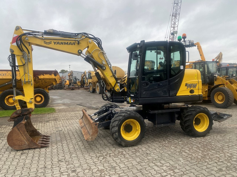 Yanmar B95w NVT - 轮式挖掘机:图1 Yanmar B95w NVT - 轮式挖掘机:图1