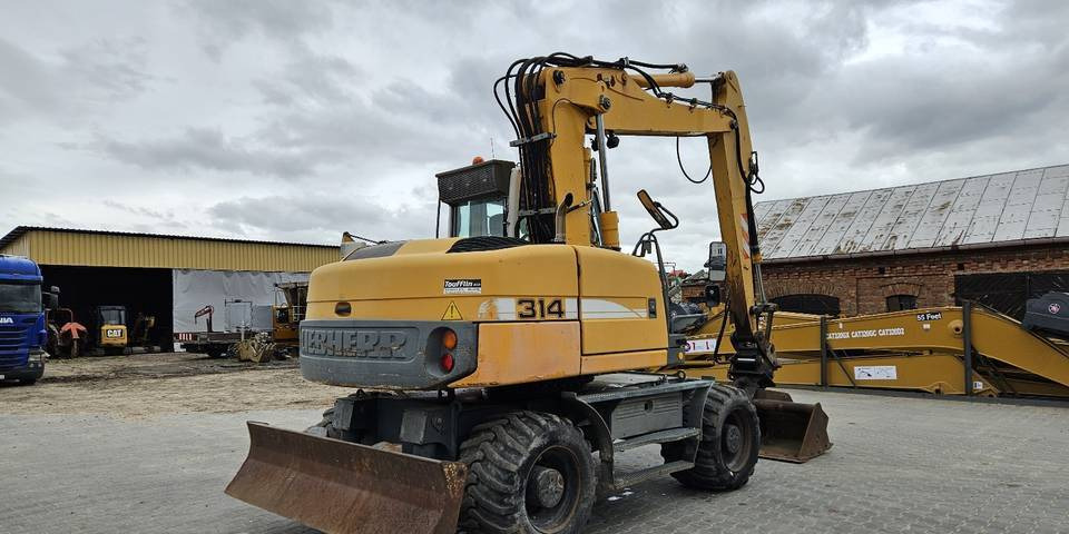 轮式挖掘机 Koparka kołowa Liebherr A314 Litronic 9350 h 4 łyżki kołówka:图6 轮式挖掘机 Koparka kołowa Liebherr A314 Litronic 9350 h 4 łyżki kołówka:图6