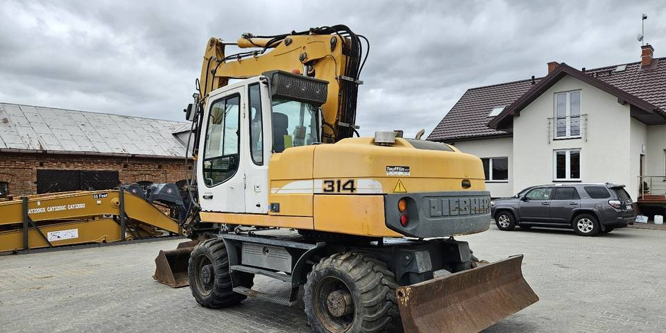 轮式挖掘机 Koparka kołowa Liebherr A314 Litronic 9350 h 4 łyżki kołówka:图8 轮式挖掘机 Koparka kołowa Liebherr A314 Litronic 9350 h 4 łyżki kołówka:图8