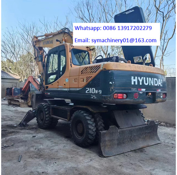 Hyundai R210W - 轮式挖掘机:图1 Hyundai R210W - 轮式挖掘机:图1