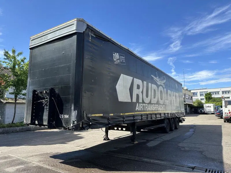 Kögel MEGA Tautliner mit ROLLENBETT Flughafentr. MEGA Tautliner mit ROLLENBETT Flughafentr. - 封闭厢式半拖车:图1 Kögel MEGA Tautliner mit ROLLENBETT Flughafentr. MEGA Tautliner mit ROLLENBETT Flughafentr. - 封闭厢式半拖车:图1