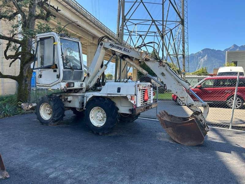 Mecalac 8CXI - 轮式挖掘机:图1 Mecalac 8CXI - 轮式挖掘机:图1