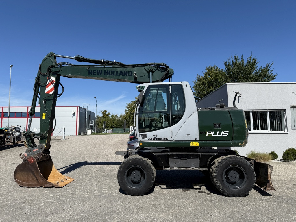New Holland MH-Plus (111695) - 轮式挖掘机:图1 New Holland MH-Plus (111695) - 轮式挖掘机:图1