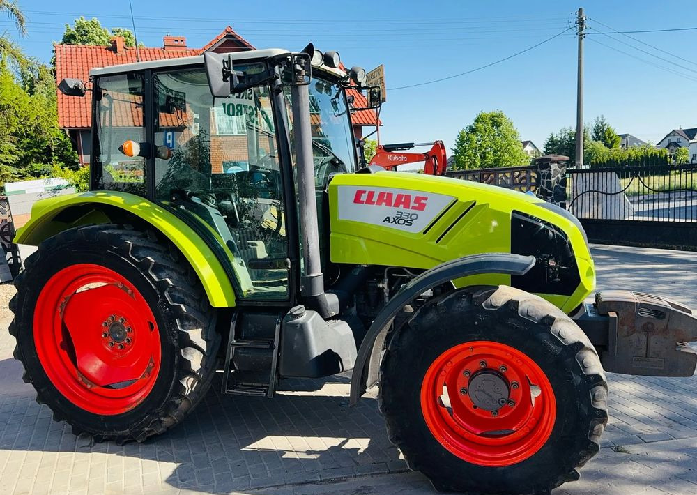 Claas Axos 330 - 拖拉机:图1 Claas Axos 330 - 拖拉机:图1